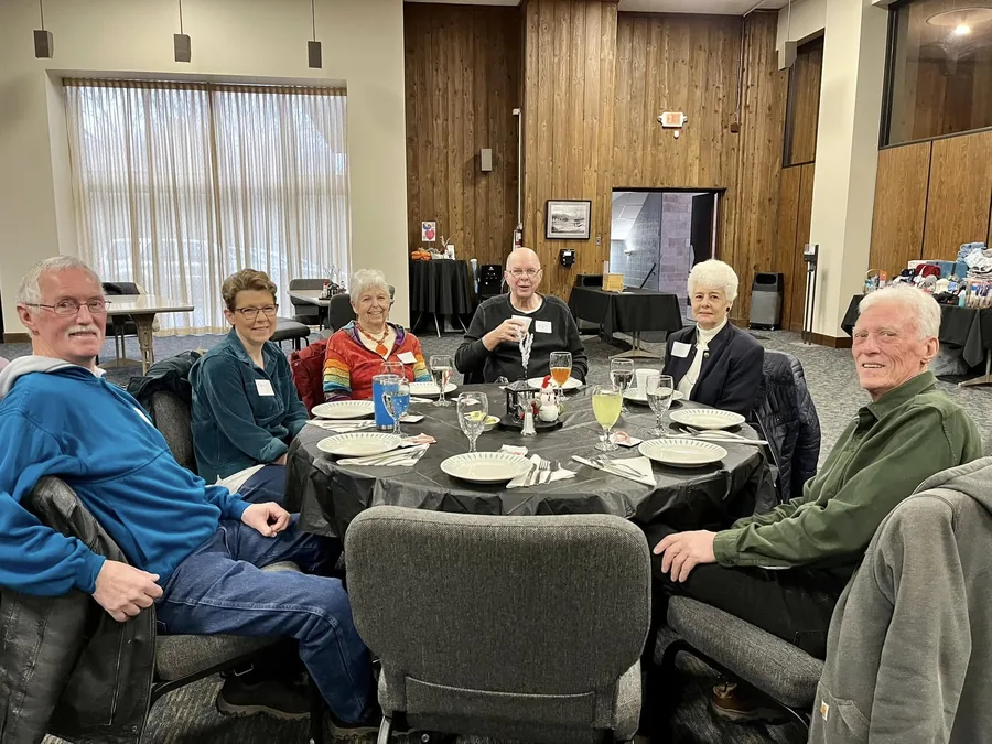 A Rush Life Group gathered around a table together